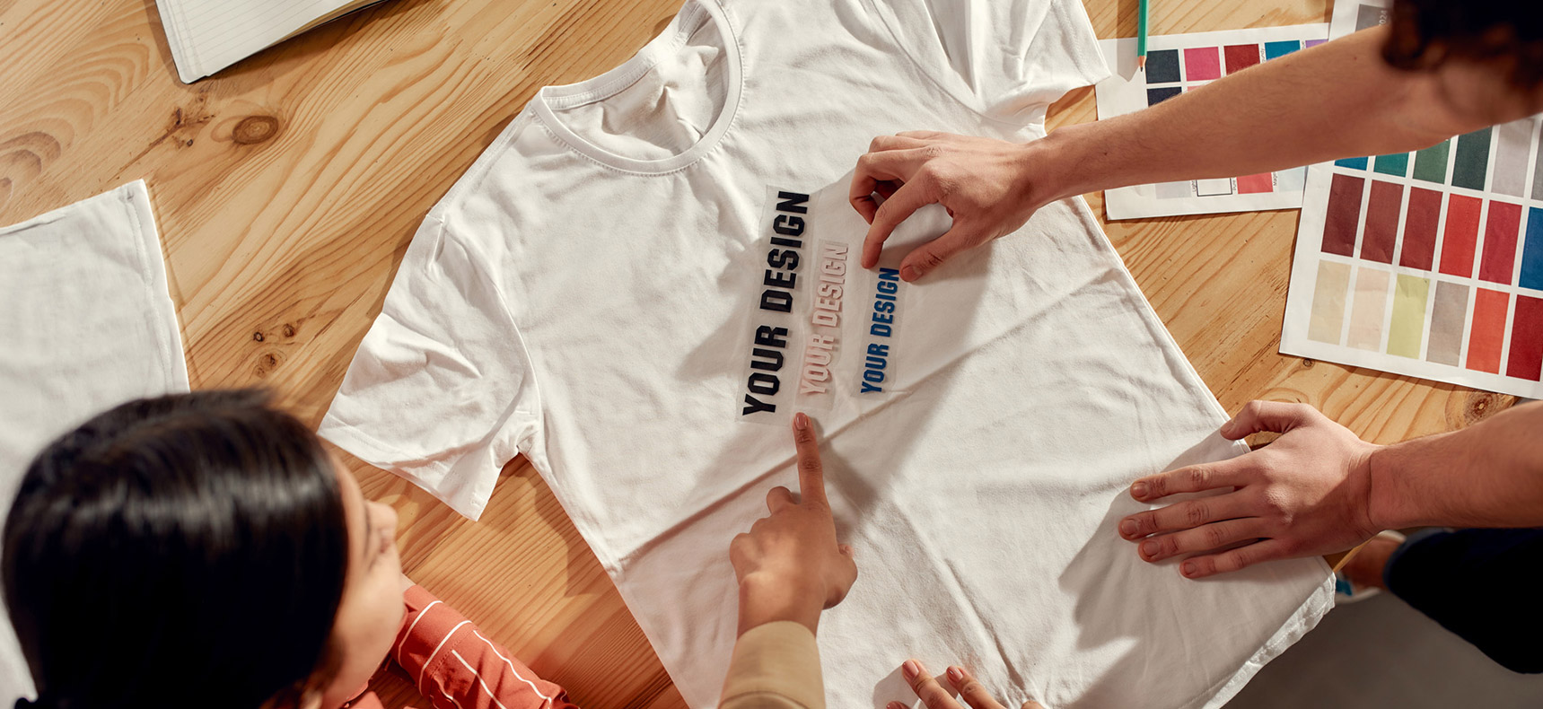 custom t house brand designers working on t-shirt