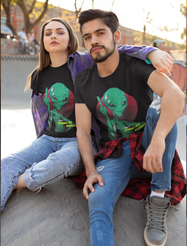 a couple wearing black color t-shirt with alien graphic printed on chest