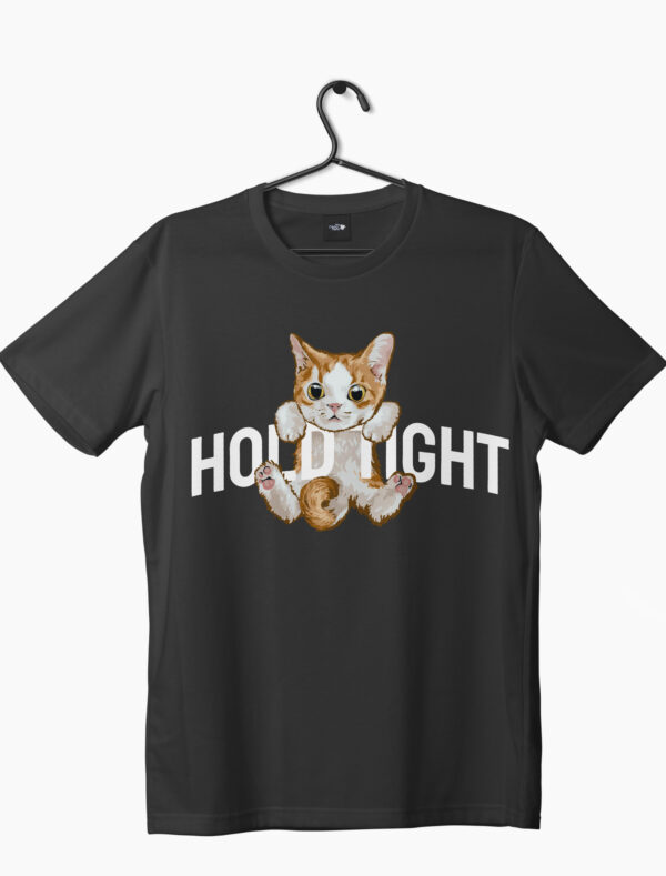 hold tight written with a kitten hanging on letter graphic printed on a black t-shirt