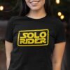 girl wearing a Black t-shirt with Yellow 'Solo Rider' graphic design on the front