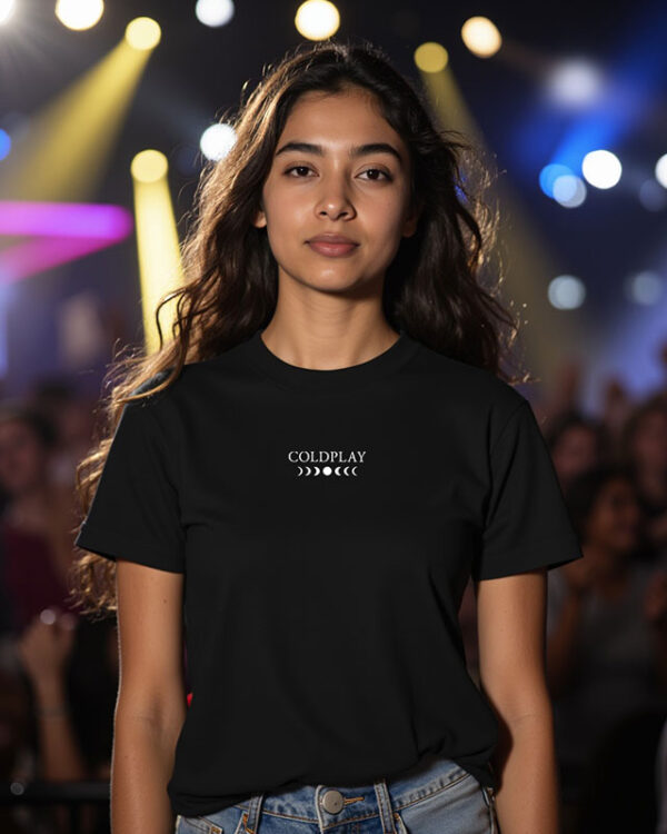 Coldplay-inspired black concert T-shirt featuring an angel wing graphic, perfect for music festivals and live shows. Made from 100% cotton with a unisex fit for comfort and style.