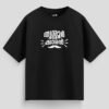 Black oversized unisex T-shirt with Malayalam text "Thrissurkaran" and mustache graphic in white print, representing Thrissur culture.