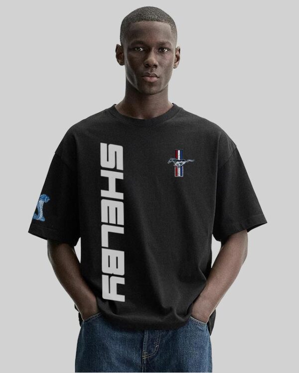 Model wearing the Bold Shelby Mustang T-Shirt in black featuring a fierce red GT350 car print and iconic Shelby branding—crafted for true car lovers.